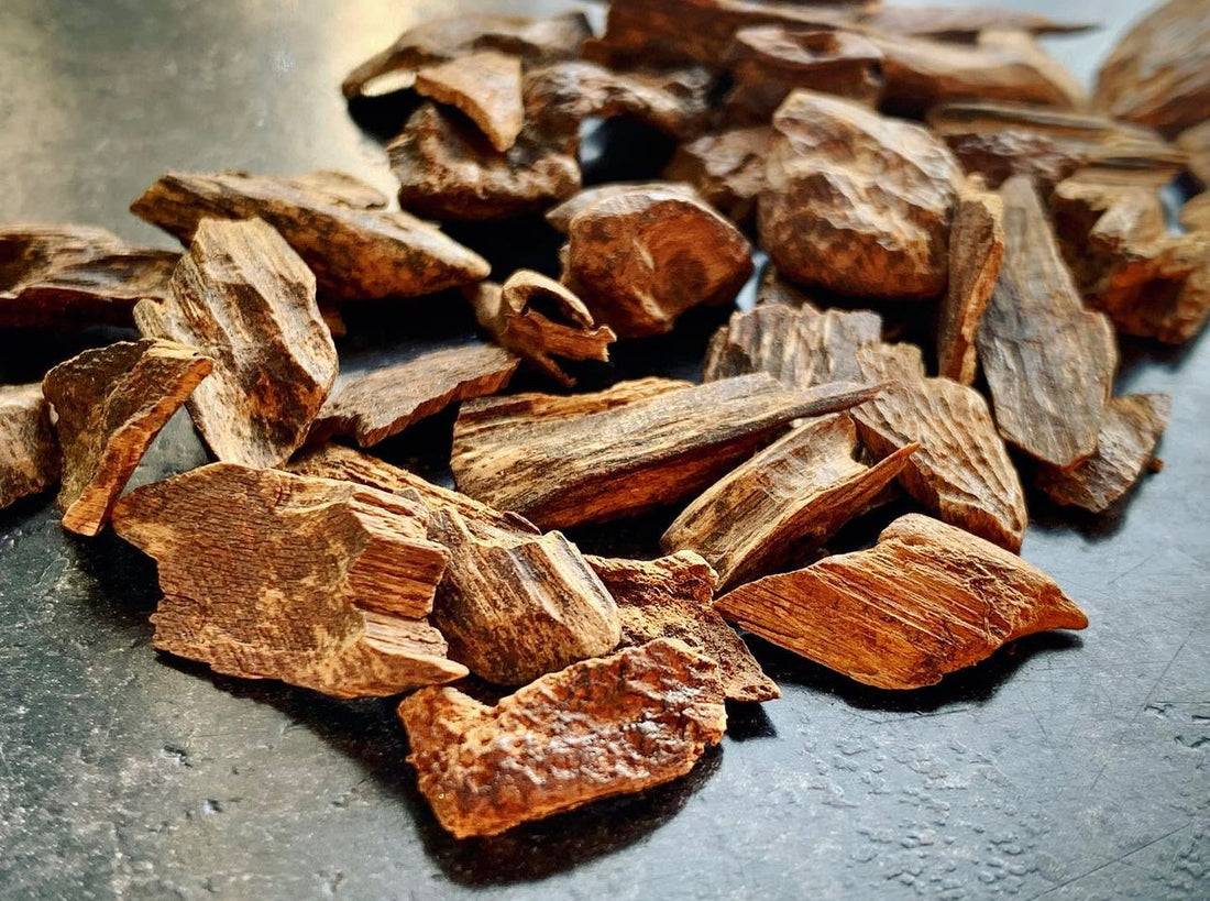 A close up of wild Agarwood on a grey kitchen worktop