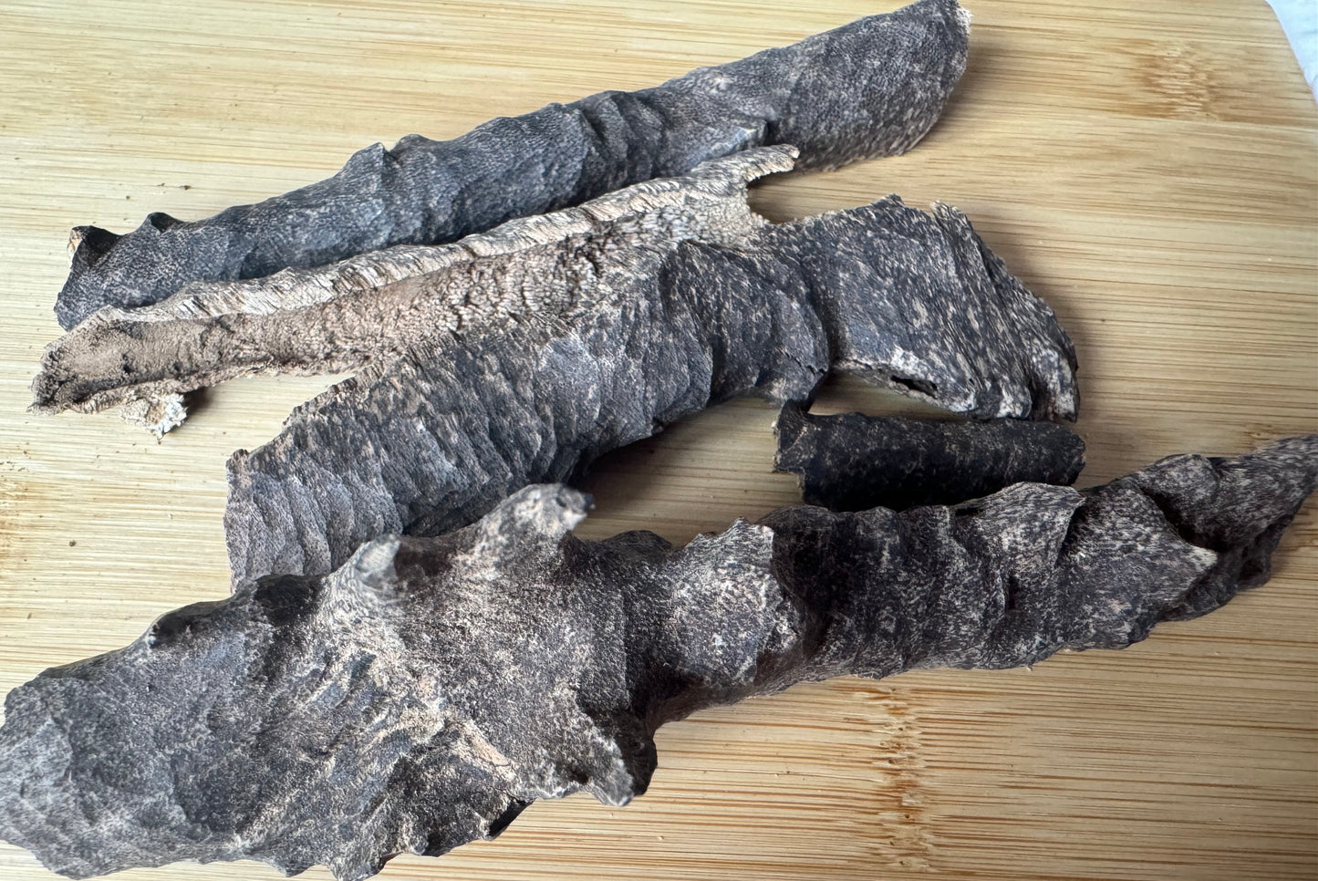 Wild Bhutan char Agarwood chips on a table 