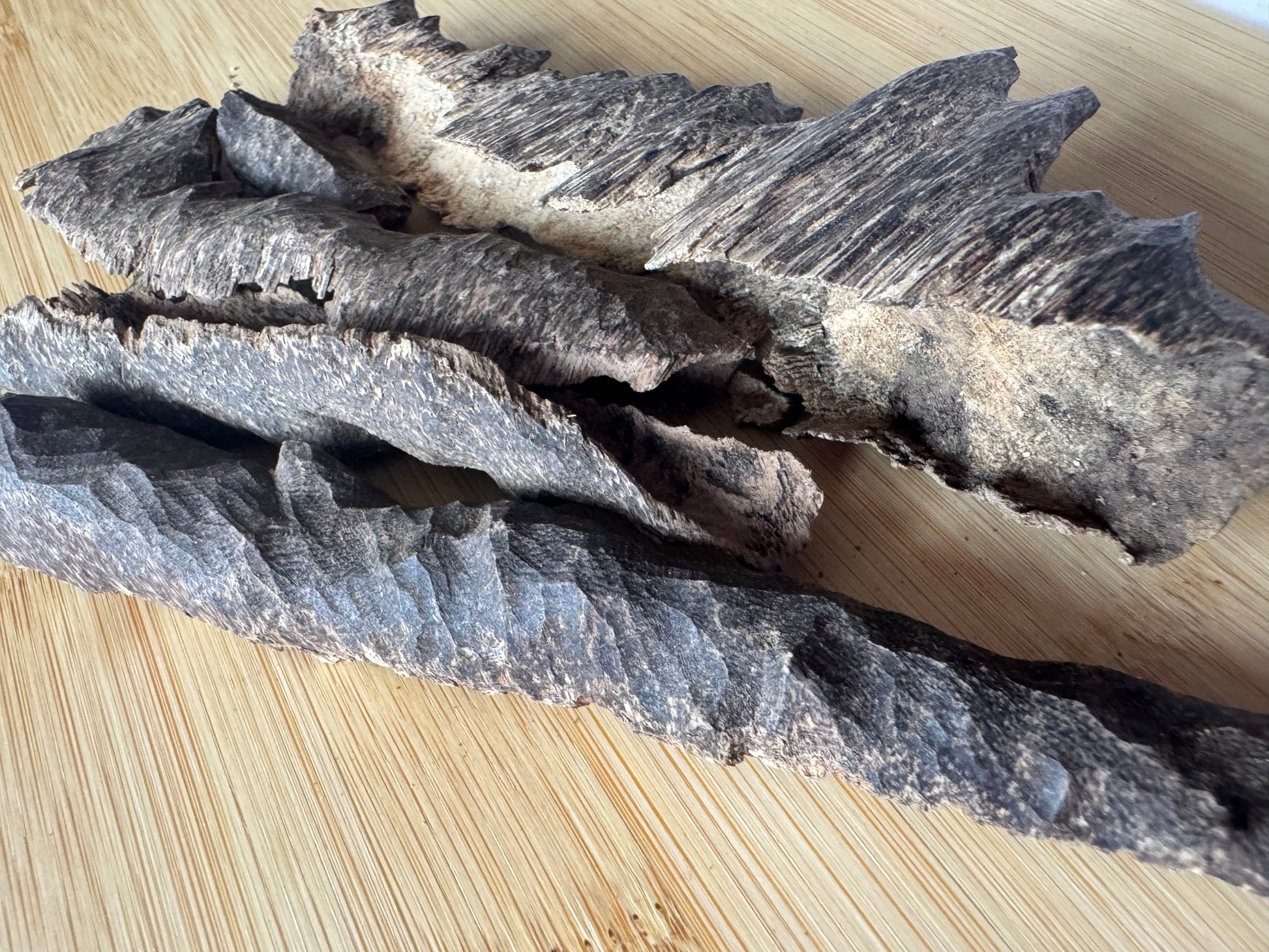 Wild Bhutan char Agarwood chips on a table 