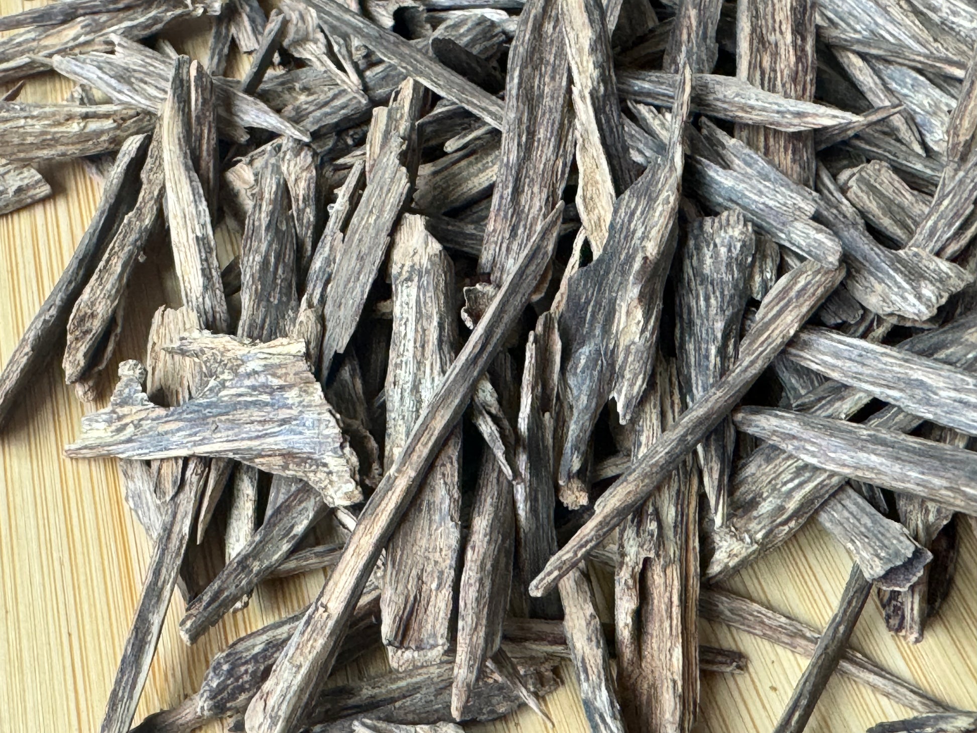 Close up of Wild Hindi Agarwood chips on a table 