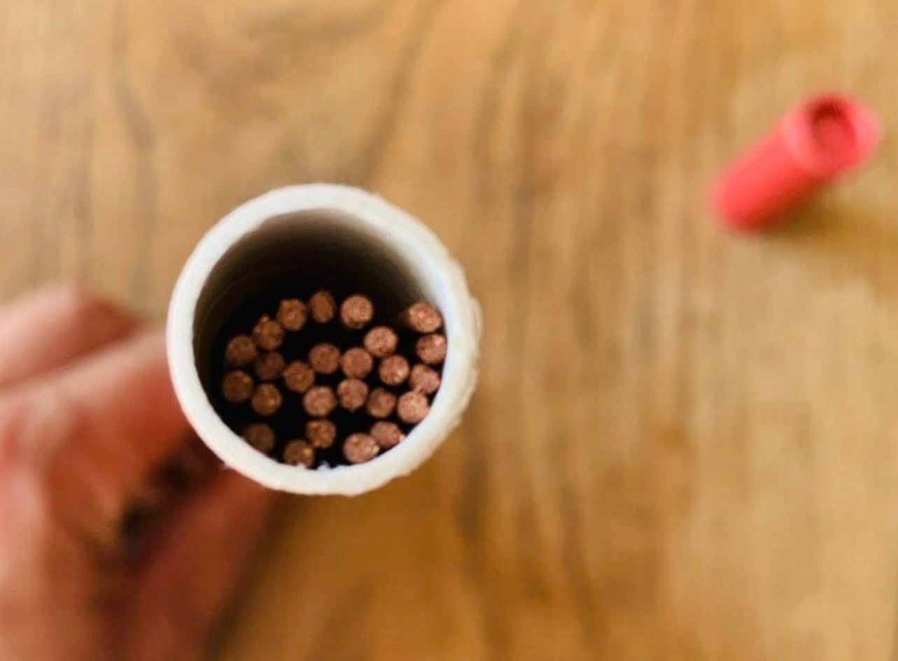 A tube of Hainan island, artisan incense sticks on a wooden table