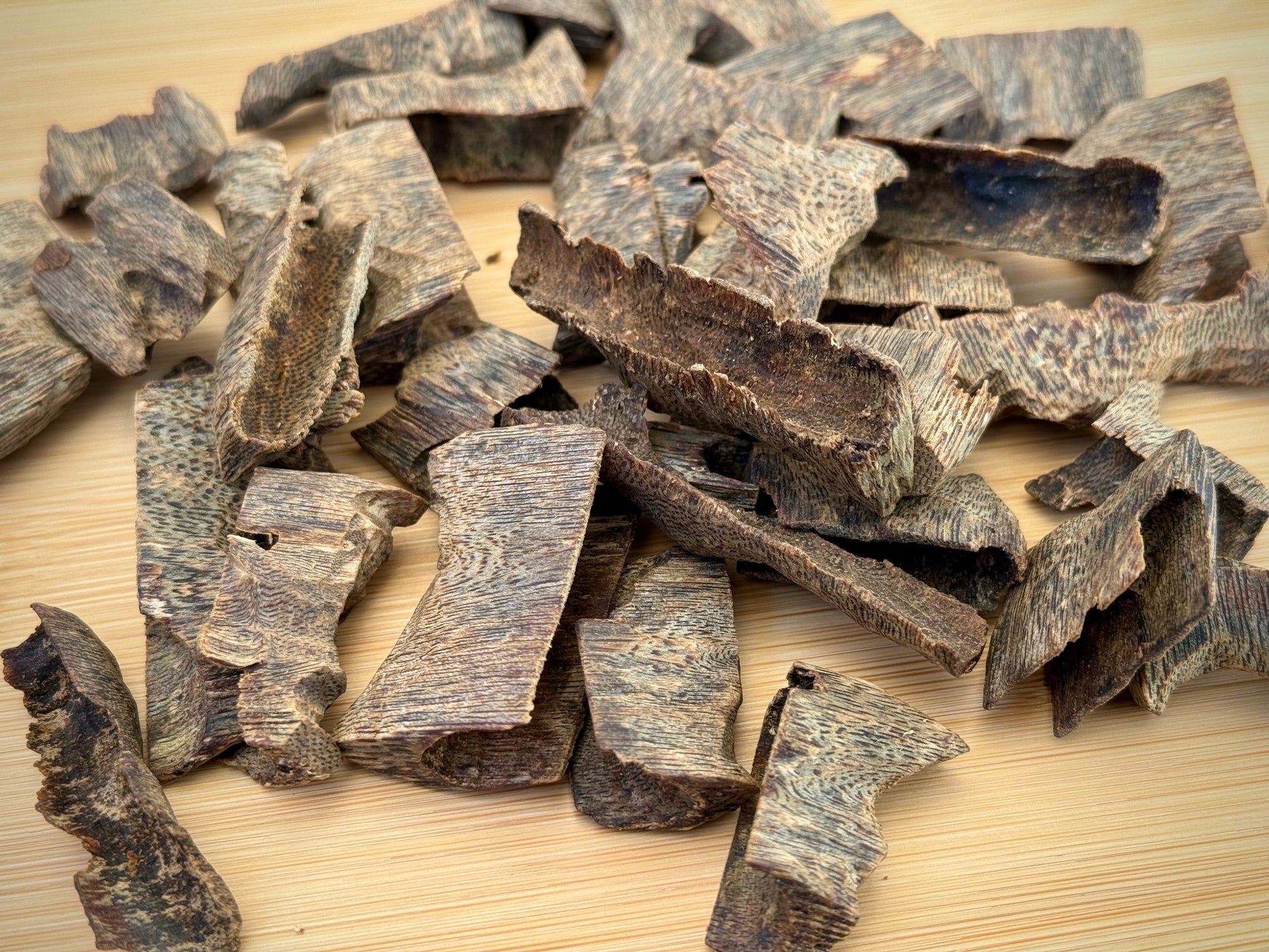 Close-up of sinking Hainan cultivated Kinam Agarwood chips