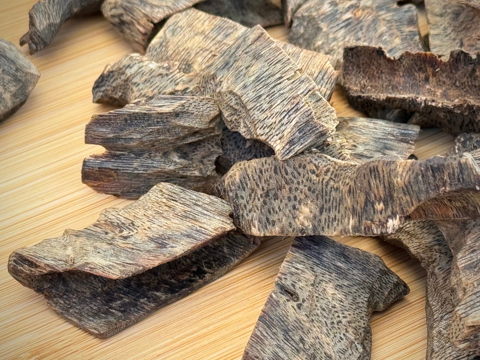 Close-up of sinking Hainan cultivated Kinam Agarwood chips